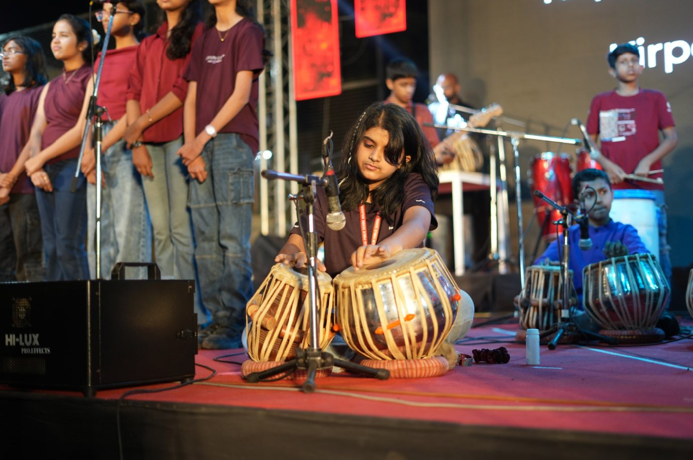 A student playing the tabla